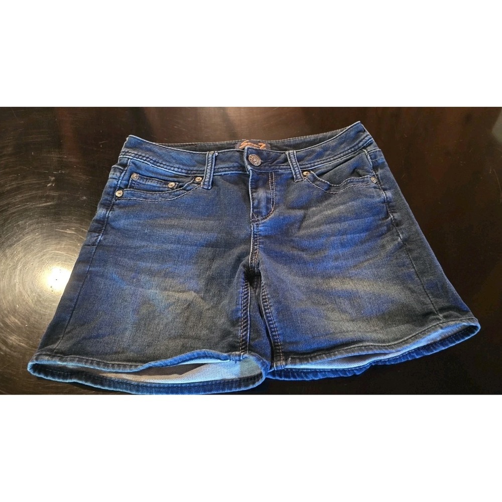 Seven7 brand denim shorts featuring a classic five-pocket design and a dark blue